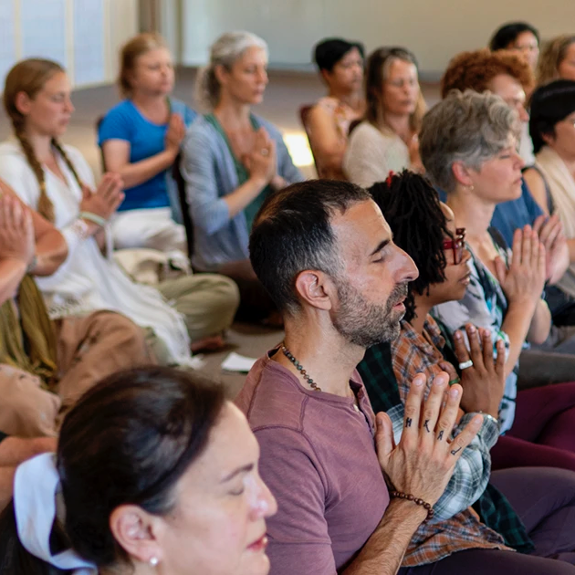 Circle of Yoga practitioners meditating at Mount Madonna Center